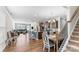 Open-concept living space with hardwood floors, dining area, and staircase, perfect for modern living at 4112 Steel Way, Sherrills Ford, NC 28673