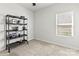 Bedroom with neutral carpet, a modern shelf, bright window, and a ceiling fan at 4427 Bright Rd, Charlotte, NC 28214