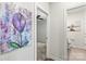 Bright hallway featuring neutral walls and entry to a bathroom and bedroom, highlighting the home's layout at 4427 Bright Rd, Charlotte, NC 28214