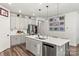 Bright kitchen featuring an island, stainless steel appliances, and modern finishes, perfect for cooking and entertaining at 4427 Bright Rd, Charlotte, NC 28214