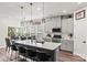 Bright kitchen featuring a center island with seating, stainless steel appliances, and modern finishes at 4427 Bright Rd, Charlotte, NC 28214
