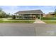 Community pavilion with picnic tables, providing a shady area for outdoor activities at 4427 Bright Rd, Charlotte, NC 28214
