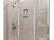 Modern shower with sleek tile, a built-in niche, and a glass door, offering a spa-like experience at 4427 Bright Rd, Charlotte, NC 28214