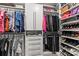 Spacious walk-in closet with custom shelving, hanging rods, and drawers for optimal organization at 4427 Bright Rd, Charlotte, NC 28214