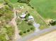 Expansive aerial view of the property, showcasing the lush greenery, spacious layout and charming home location at 4478 Fork Rd, Norwood, NC 28128