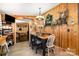 Dining area with rustic decor and stylish wood paneling, seamlessly connecting to other living spaces at 4478 Fork Rd, Norwood, NC 28128