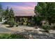 Charming log cabin home boasts a covered porch and well-maintained landscaping at 4478 Fork Rd, Norwood, NC 28128