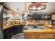 Eat-in kitchen equipped with a wooden counter, black cabinets, and ample storage space at 4478 Fork Rd, Norwood, NC 28128