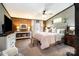 Comfortable bedroom with wainscoting, a soft bed, and bright windows, creating a peaceful retreat at 4478 Fork Rd, Norwood, NC 28128