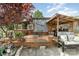 Inviting outdoor kitchen and dining area, perfect for entertaining guests at 4478 Fork Rd, Norwood, NC 28128