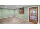 Finished basement with wood-look flooring, door to outside, and natural light offers many possibilities at 469 Augusta Dr, Statesville, NC 28625