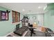 Finished basement with exercise equipment offers flexible living space for fitness enthusiasts at 469 Augusta Dr, Statesville, NC 28625