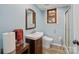 Charming bathroom featuring wood-trimmed window, modern toilet, and glass-enclosed shower at 469 Augusta Dr, Statesville, NC 28625