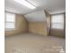 Spacious bedroom features neutral walls and carpeted floors, illuminated by natural light from two windows at 469 Augusta Dr, Statesville, NC 28625