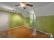 Bonus room featuring wood floors, recessed lights and bright green walls at 469 Augusta Dr, Statesville, NC 28625