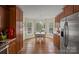 Bright kitchen features wood cabinets, modern appliances, and a sunlit breakfast nook with backyard views at 469 Augusta Dr, Statesville, NC 28625