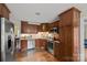 Modern kitchen with stainless steel appliances, and dark cabinets offers both style and functionality at 469 Augusta Dr, Statesville, NC 28625