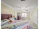 Bright main bedroom with a ceiling fan, neutral carpet and large, quilted bedspread at 469 Augusta Dr, Statesville, NC 28625