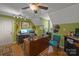 Bright office featuring a ceiling fan, wood floors, and bright green walls at 469 Augusta Dr, Statesville, NC 28625
