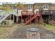 Backyard featuring tiered decks and an outdoor fireplace at 485 Camrose Ne Cir, Concord, NC 28025
