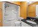 Bathroom featuring tub, toilet, shower, large framed mirror, and dark granite countertop at 485 Camrose Ne Cir, Concord, NC 28025