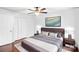 This bedroom has a ceiling fan and ample storage space with the closet and side tables at 485 Camrose Ne Cir, Concord, NC 28025