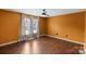 Bedroom featuring wood floors, light filled window, and neutral walls at 485 Camrose Ne Cir, Concord, NC 28025