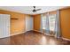 Bedroom featuring wood floors, a closet, and large windows at 485 Camrose Ne Cir, Concord, NC 28025