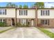 Charming brick townhome featuring well-maintained landscaping and inviting curb appeal at 485 Camrose Ne Cir, Concord, NC 28025