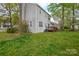 Wide backyard of this home with a view of the exterior and wooden deck at 6020 Running Deer Rd, Charlotte, NC 28214