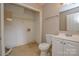 Bathroom with vanity, toilet, closet, and linoleum floors at 6020 Running Deer Rd, Charlotte, NC 28214