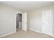 Bedroom with neutral walls, carpet flooring, an open door and a closed door at 6020 Running Deer Rd, Charlotte, NC 28214