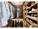 Custom walk-in closet with multiple shelving units and closet organizers at 6147 Lake Providence Ln, Charlotte, NC 28277