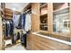 Custom walk-in closet featuring built-ins and ample storage space at 6147 Lake Providence Ln, Charlotte, NC 28277