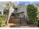 Contemporary home featuring a landscaped front yard and stairs to the front door at 6147 Lake Providence Ln, Charlotte, NC 28277
