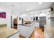 Bright kitchen features white cabinetry, stainless steel appliances, and hardwood floors at 6147 Lake Providence Ln, Charlotte, NC 28277