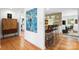 Hallway view of kitchen and bar seating area, featuring hardwood floors and modern decor at 6147 Lake Providence Ln, Charlotte, NC 28277