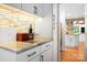 Well-lit kitchen area with modern cabinets, marble countertops, and stylish backsplash at 6147 Lake Providence Ln, Charlotte, NC 28277