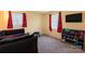 Bedroom features two windows, a TV, storage shelves, and neutral carpet at 619 Center St, Gastonia, NC 28054