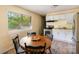 Kitchen nook featuring a window, wooden table with chairs, and modern appliances at 619 Center St, Gastonia, NC 28054