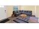 Inviting living room with a comfortable gray sectional sofa and stylish geometric rug at 619 Center St, Gastonia, NC 28054