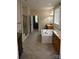 Bathroom featuring a soaking tub, double vanity, tiled floors, and neutral colors at 7798 Sand Trap Ln, Stanley, NC 28164