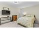 Cozy bedroom with soft neutral tones, a comfy bed, and a mounted television at 7798 Sand Trap Ln, Stanley, NC 28164