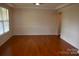 Formal dining room with hardwood floors, chair rail, and wainscoting at 7798 Sand Trap Ln, Stanley, NC 28164
