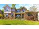 Inviting brick home featuring a stone accent wall and covered front porch at 7798 Sand Trap Ln, Stanley, NC 28164