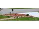 Charming front yard with decorative mulch, rocks, and lush green grass at 7798 Sand Trap Ln, Stanley, NC 28164