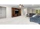 Bright living room with carpet, a large TV, and neutral colors throughout at 7798 Sand Trap Ln, Stanley, NC 28164