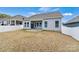 Exterior home shot showing a fenced-in backyard and outdoor living space at 7850 Fountaingrass Ln, Sherrills Ford, NC 28673