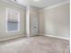 Neutral bedroom featuring a double door closet, a window with blinds and neutral carpeting at 7850 Fountaingrass Ln, Sherrills Ford, NC 28673