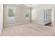 Bright bedroom with large windows, neutral walls, plush carpet, and adjoining room access at 7850 Fountaingrass Ln, Sherrills Ford, NC 28673